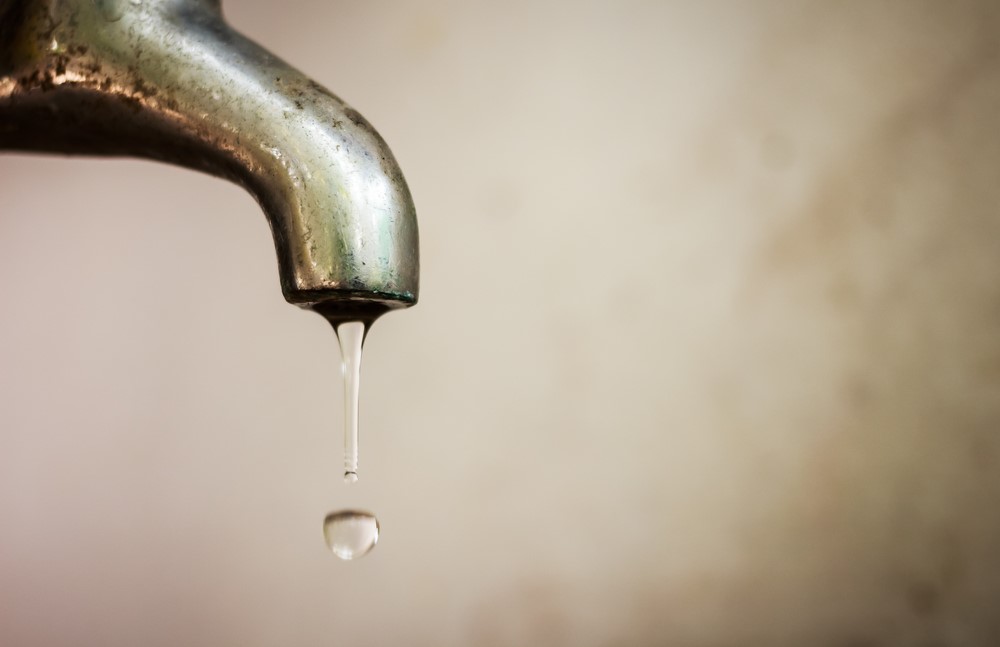 water drop running out of tap
