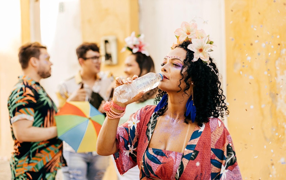 Woman drinking water at a street festival