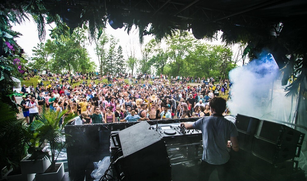 dj on stage at a music festival