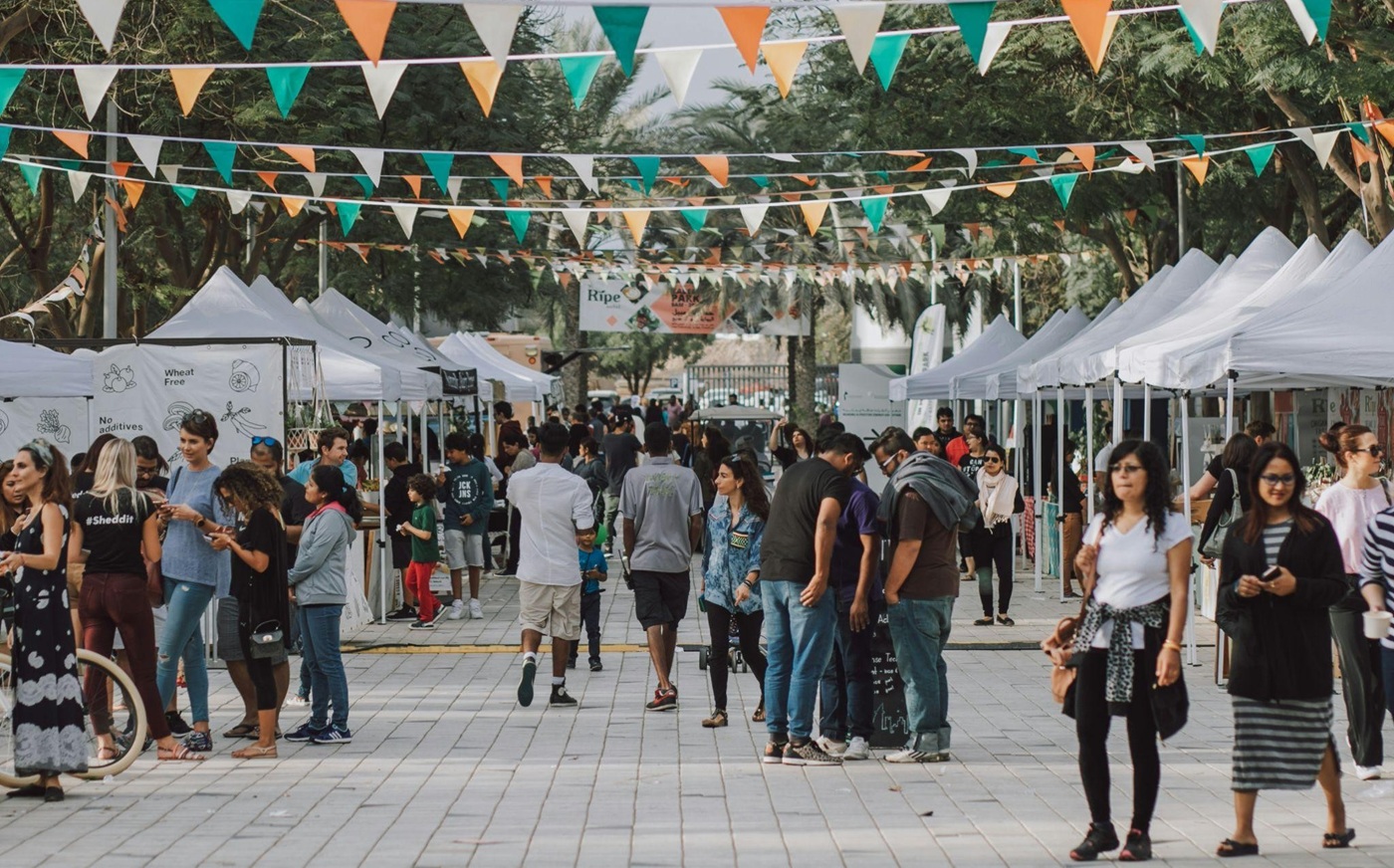A crowd of people at an outdoor festival
