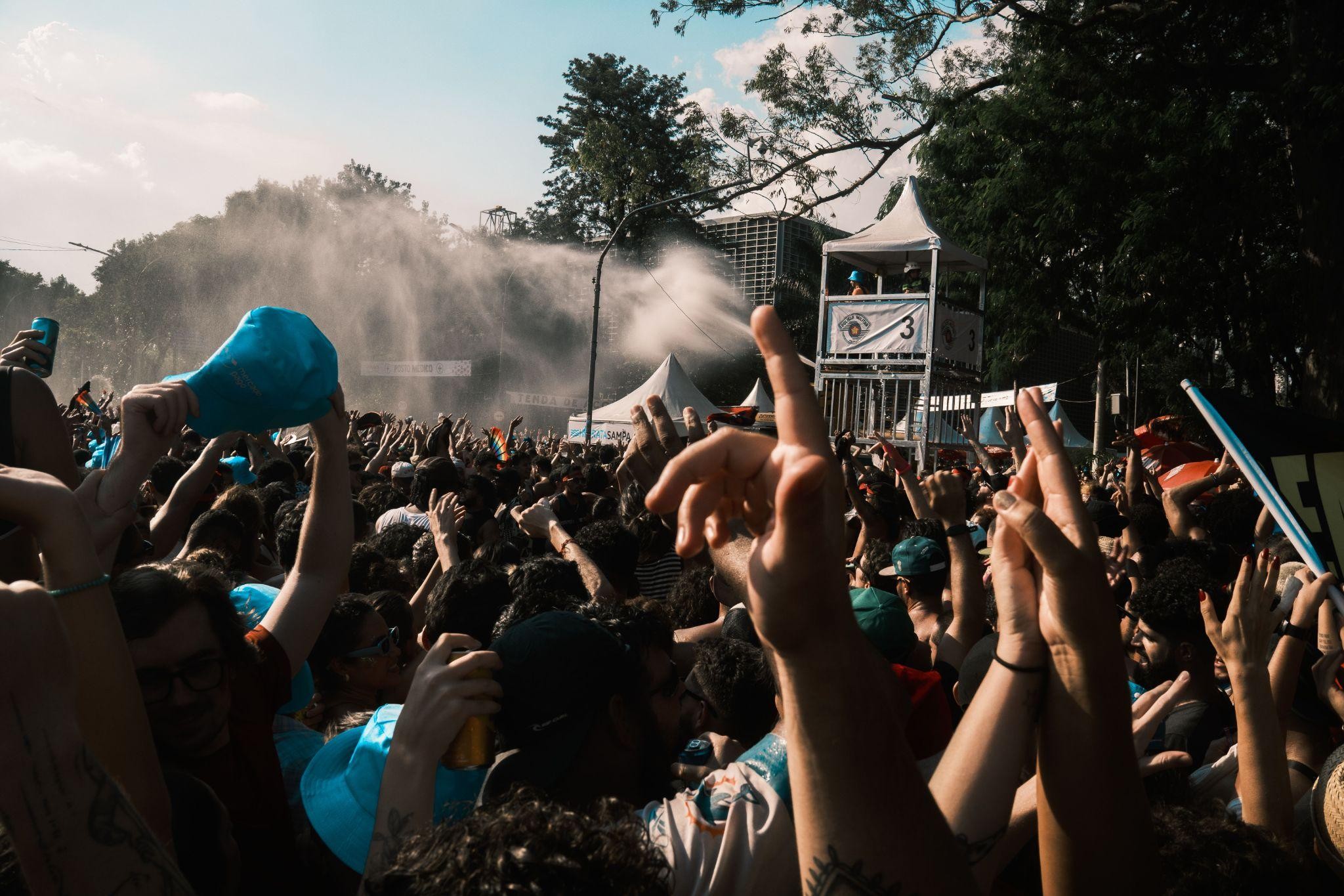 A large crowd at an outdoor music festival